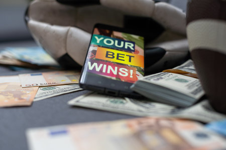 betting on sports, smart phone with working online betting mobile applicationの写真素材