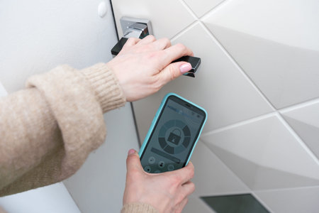 Hotel door security Unlocking by application on mobile phone. Digital door lock, key less system of...