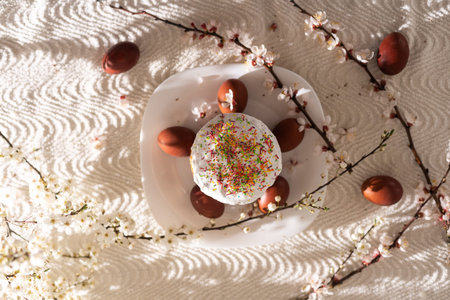 Easter cake and painted eggs blooming branch