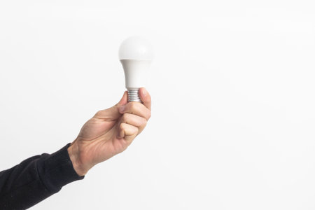 Human hand holding white lightbulb. Ideas creativity, inspiration, concepts