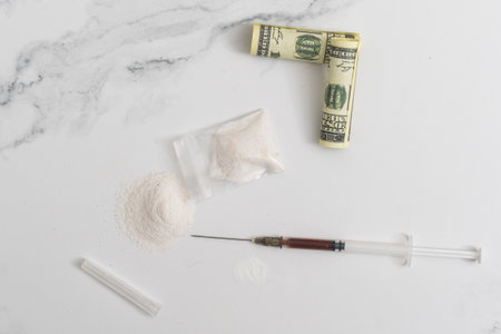 Drugs, money and syringes, isolated on White backgroundの写真素材