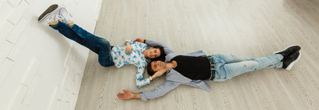 Young couple fooling around indoorsの写真素材