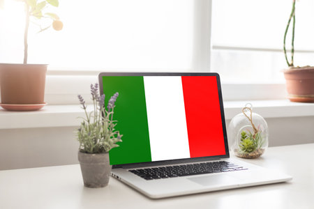 laptop with LEARN ITALIAN on a screen. Education learning italian language school conceptの写真素材