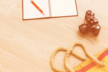 Set of travel things on wooden background. accessories and essential journey items, copy space for text, summer vacation planning and wanderlust conceptの写真素材