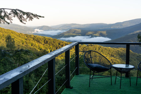 Wooden desk and panorama of early spring in the mountains. Carpathian, Ukraine, Europe.の写真素材