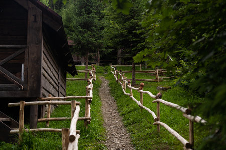 Old wooden farmhouse fence with jugsの写真素材