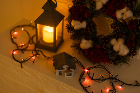 Christmas ring or wreath with glowing garland on background.の写真素材