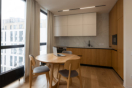 Blurred view of modern kitchen interior with white furnitureの写真素材