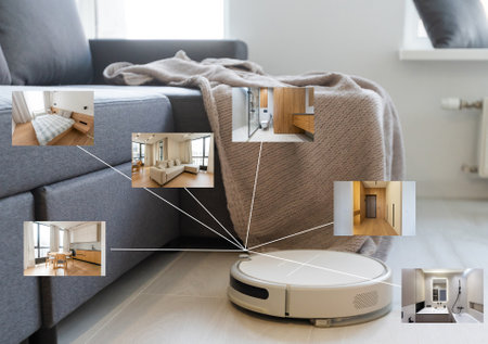 people, housework and technology concept. robot vacuum cleaner.の写真素材