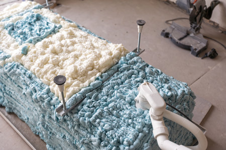 Large furnished bathroom in luxury home with tile floor, shower, bathtub, and view of master bedroomの写真素材