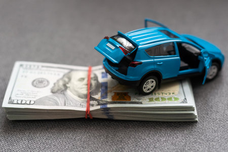 car and money. concept of car, Rent, car insurance, Toy car and money over white.の写真素材