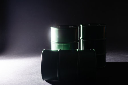 tin barrels on black background isolated close up, one round oil drum, steel keg, tin food can, canister, aluminium cask, petroleum storage packaging, fuel container, gasoline tank, canned goodsの写真素材
