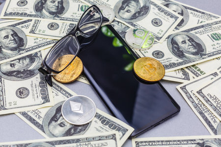 bitcoin to phone. bitcoin and shiny gold barsの写真素材