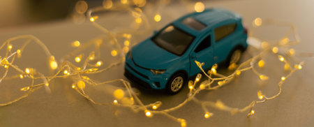 Miniature Car on colorful bokeh background. Holiday Merry Christmas concept.の写真素材