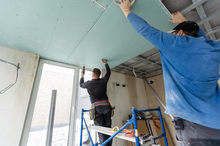 Construction worker installation ceiling work