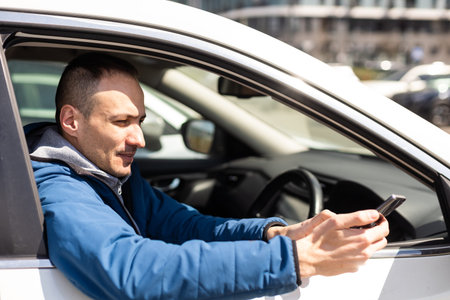 Best App. Happy Young Indian Man Showing Big Blank Smartphone At Camera While Sitting In Car,...
