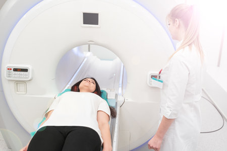 Medical CT or MRI Scan with a patient in the modern hospital laboratory. Interior of radiography department. Technologically advanced equipment in white room. Magnetic resonance diagnostics machineの写真素材