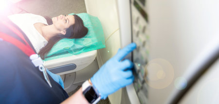 beautiful woman lying on ct scanner bed during tomography test in hospital