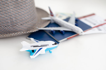 Tourist concept. Passport with airplane, tickets, hat, glasses