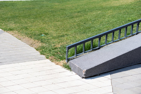 Green lawn, a view of the playground, a beautiful area near the apartment building.の写真素材
