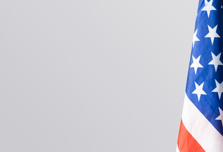 Closeup of American flag on plain backgroundの写真素材