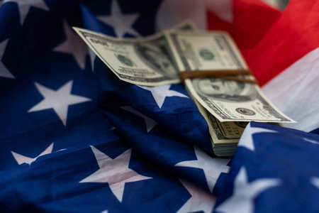 USA national flag and dollar bills. Business and finance concept