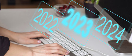 Development of successful economic growth in 2022, 2023 to 2024 concept. Businessman forecast analysis plan profit chart with pen and increase of positive indicators. Economy recovery after falling.の写真素材