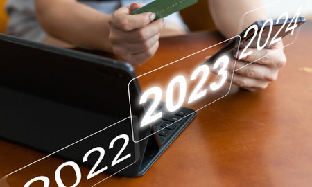 Development of successful economic growth in 2022, 2023 to 2024 concept. Businessman forecast analysis plan profit chart with pen and increase of positive indicators. Economy recovery after falling.の写真素材