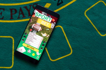 Smartphone with gambling mobile application. Sport and betting conceptの写真素材