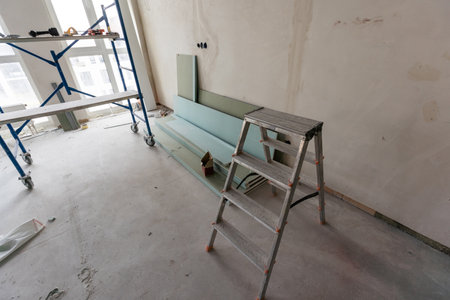 Ceiling installation with expert technicians In the room that is in the construction processの写真素材