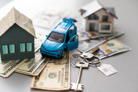 House model and car, laptop contract document on table, real estate business concept.の写真素材
