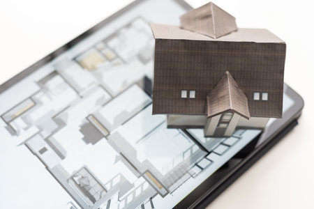 Small house model is on table and icons home electronics devices connecting with wireless. Smart home controlled and Automation system technology of thingsの写真素材