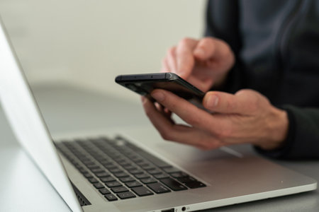 Businessman working with laptop, smartphone in hand. computer on the desk. Business concept.の写真素材