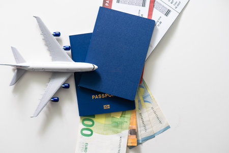 Airplane, passport and money - traveling conceptの写真素材