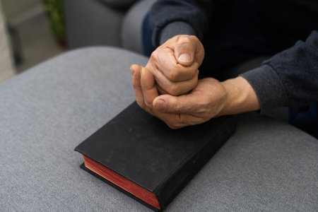 Hands of man praying to god with the bible, Concept of faith for godの写真素材