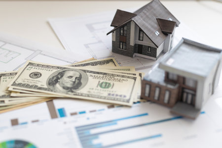 Miniature paper house with moneyの写真素材