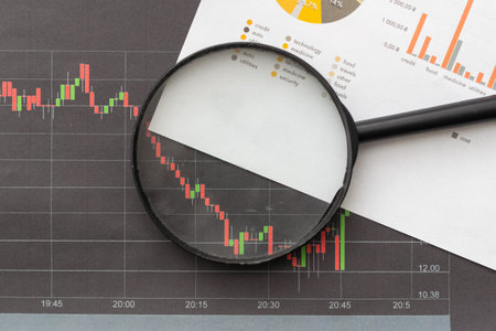 Financial charts on the table with tablet and penの写真素材