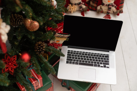 Laptop on background of Christmas interiorの写真素材