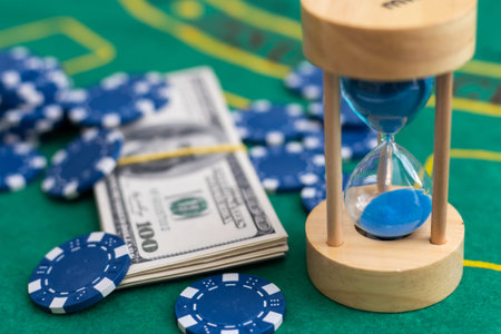 Poker playing chips with card and dollar banknoteson a casino green table. Online gambling. Texas