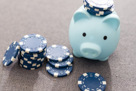 This eye catching image of two miniature businessmen shaking hands could be used for the stock market, banking, real estate and wealth management. The blue chips represent a solid investment.の写真素材