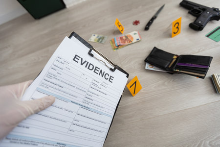 Crime scene investigation - collecting bullet of pistol on the groundの写真素材