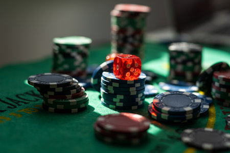 Casino gambling chips on green table. All for game. Pokerの写真素材