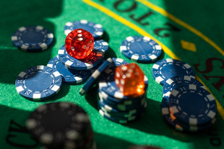 Poker Chips on a gaming table with dramatic lightingの写真素材