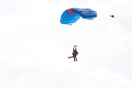 Skydiving. Tandem jump. An amazing adventure into the sky.の写真素材