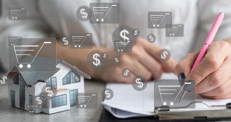 Online shopping and e-commerce concept. Young woman using laptop computer with shopping cart icon, order in online store, shopping on internet, concept on virtual screen with hands typing on keyboardの写真素材