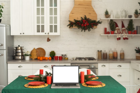 Laptop on the christmas table. Video call with the familyの写真素材