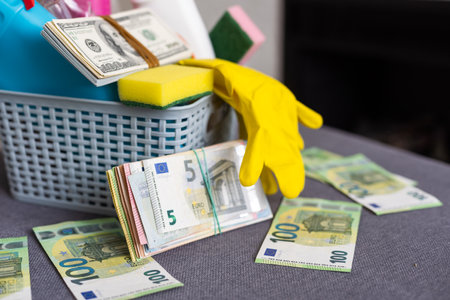 Brushes, sponges, rubber gloves and natural cleaning products in the basket. Eco-friendly cleaning productsの写真素材