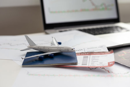 Airplane and money. Plane on the background of USA dollars. The cost of travel, air tickets and flights, financial expenses for vacation.の写真素材