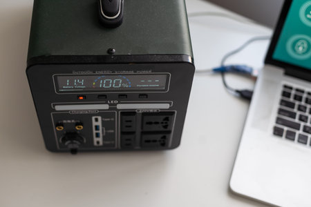 Charging station for phone, tablet, laptop and other gadgets when there is no light during blackout. Generator power bank battery in the absence of electricity. Charge electric rechargeable batteryの写真素材