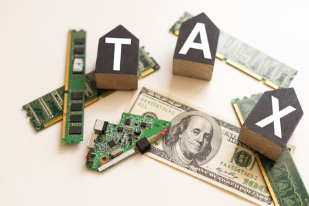 Tax text in wooden cubes and tax or vat form documents to complete Individual income tax return form for payment to Government. Calculation tax return in 2022 to 2023.の写真素材